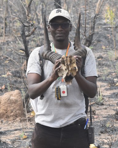 Omobayo Ghislain Zouffoun holding a skull